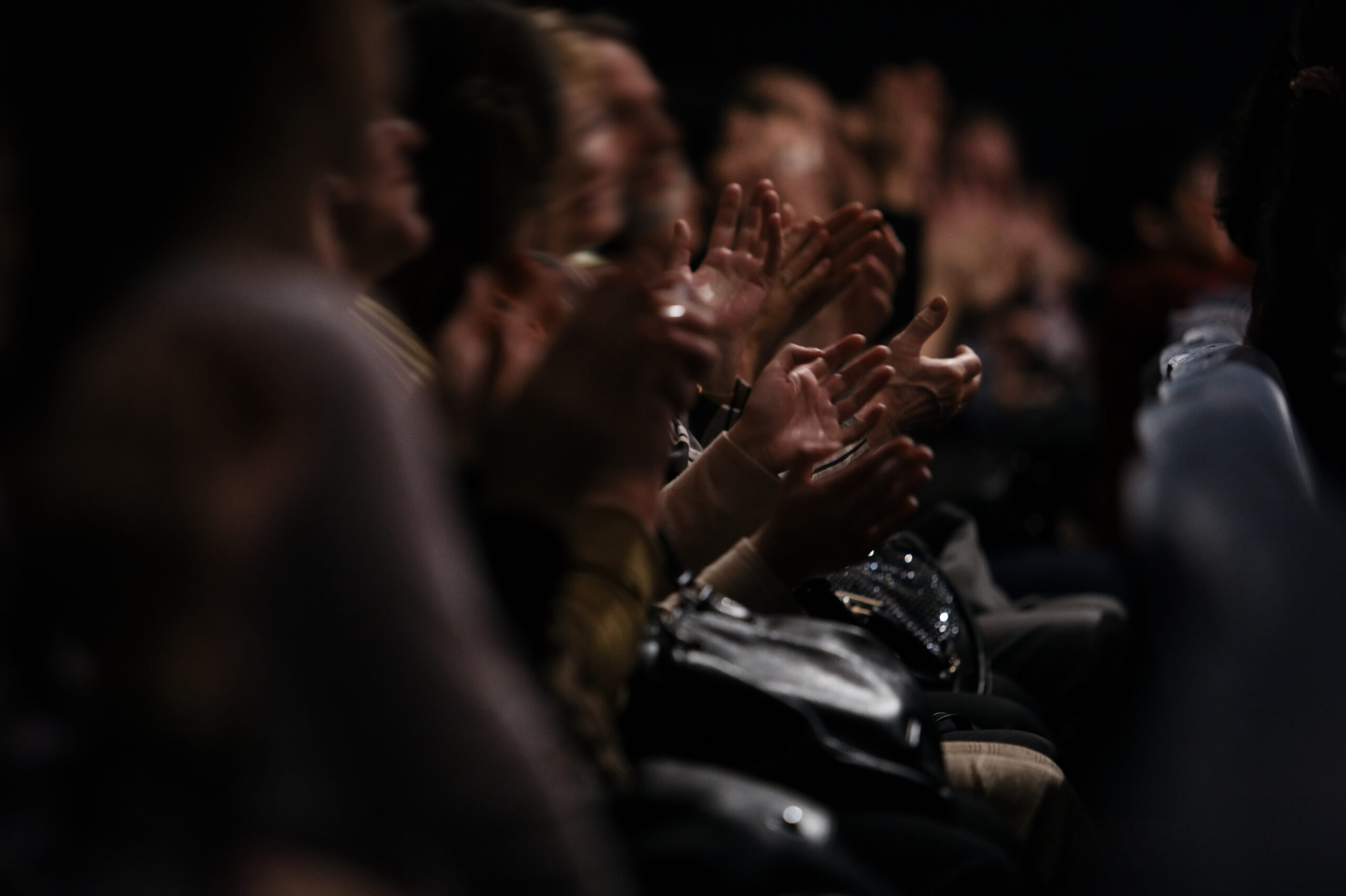 Audience clapping their hands